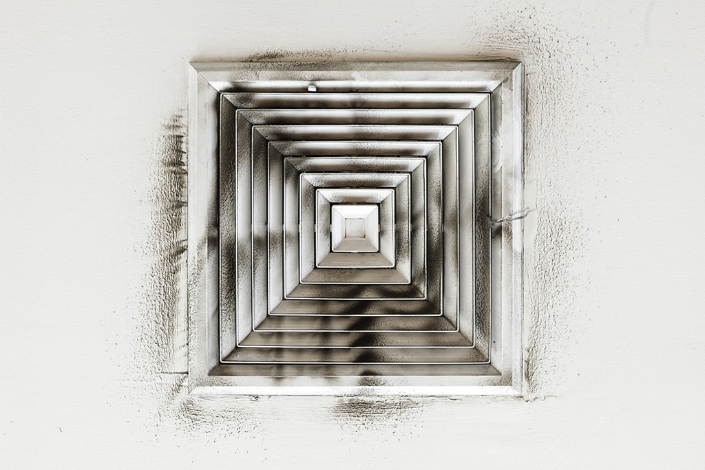 Heavy dust and debris buildup on vent louvers