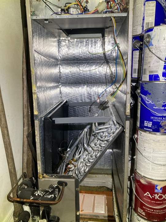 Air handler with coil pulled for cleaning