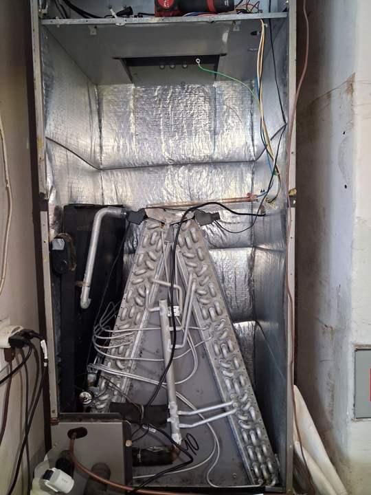 Evaporator coil exposed inside the air handler