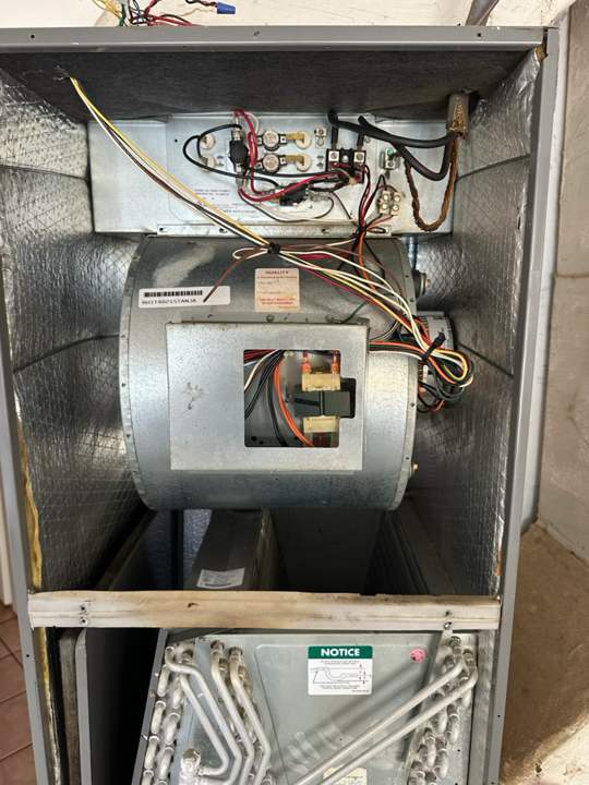 Air handler opened up with the blower assembly exposed