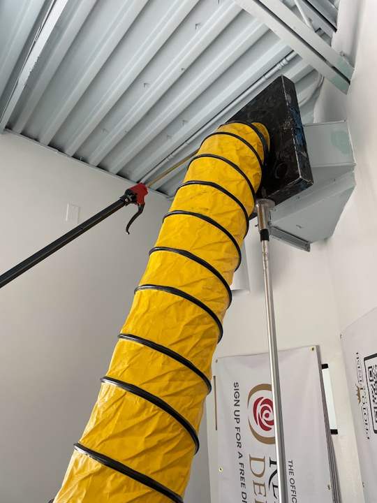 Negative-air hose connected for commercial duct cleaning